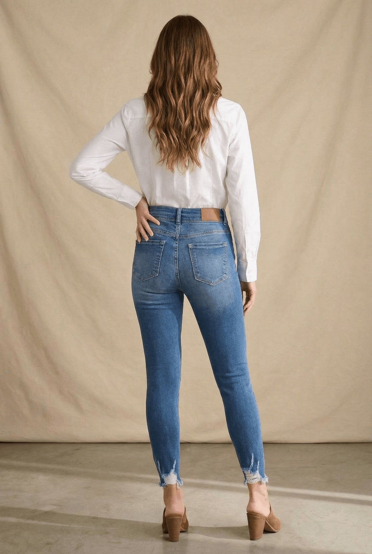 Artemis Vintage Rebel ultra-high-rise skinny ankle jeans with a corset-style double waistband and distressed hem.