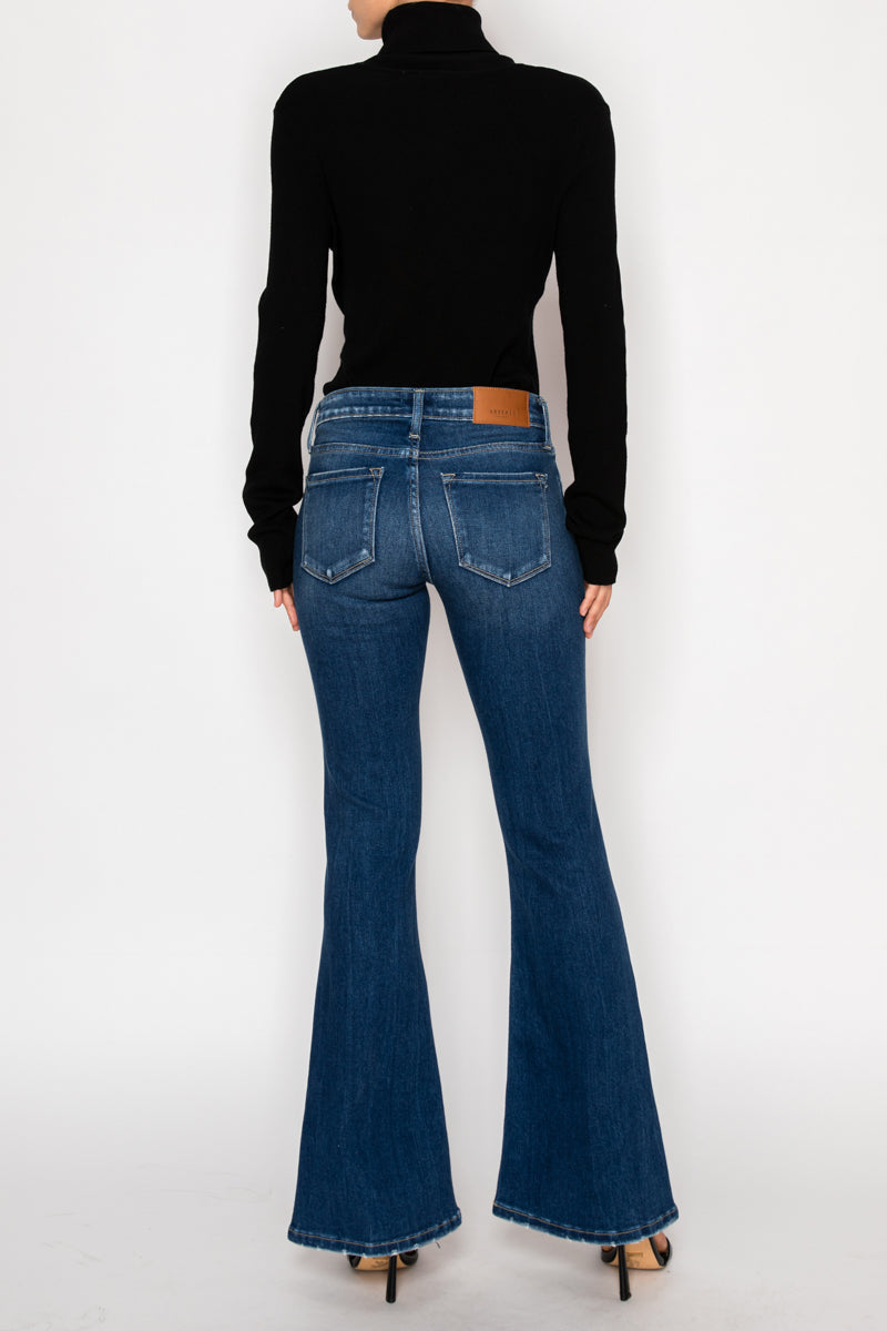 Artemis Vintage Margaret low-rise vintage flare jeans in dark-wash stretch denim with knee distressing.